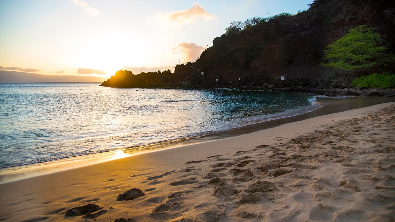 The sun sets along Ka’anapali Beach in West Maui.