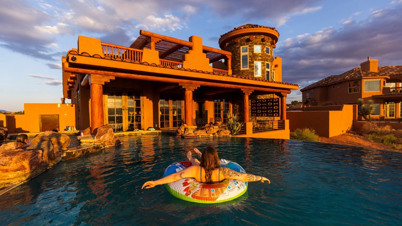 Anna floats near the rental house.