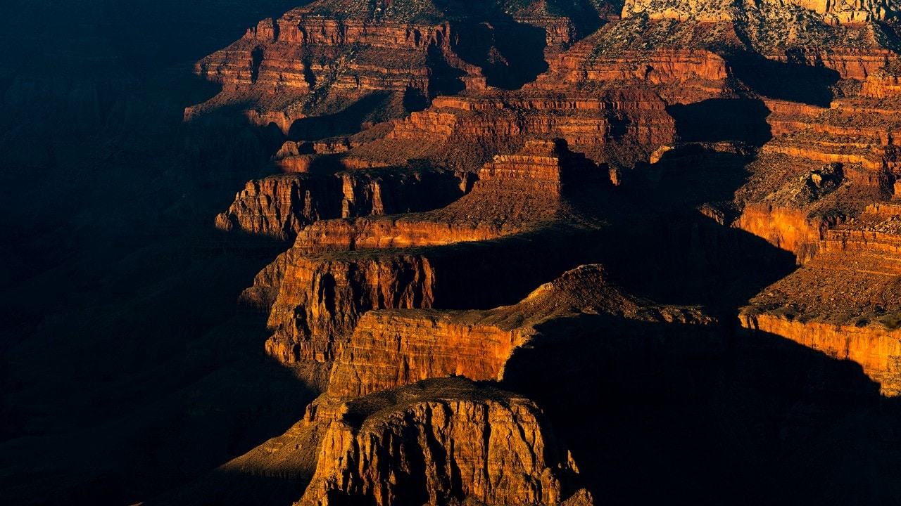 The sunset lights up the depths of the Grand Canyon as seen from Yavapai Point.