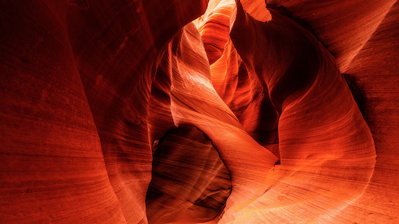 An archway connects the walls of Lower Antelope Canyon, seen during a morning tour.