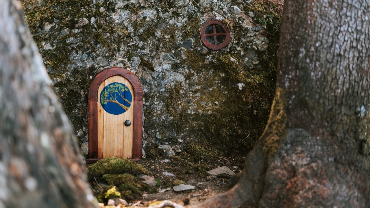 Miniature fairy doors decorate the trails to Mount Erskine.