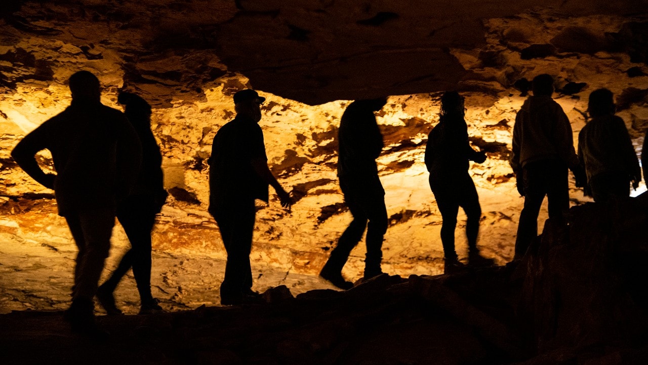 Visitors walk through Wind Cave during the Fairgrounds Tour. 