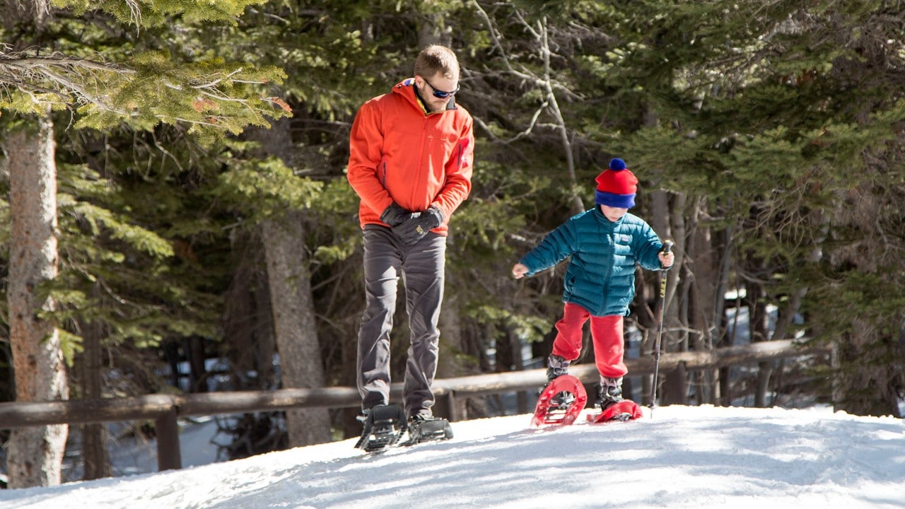 Joel and Theo talk while getting used to snowshoes.