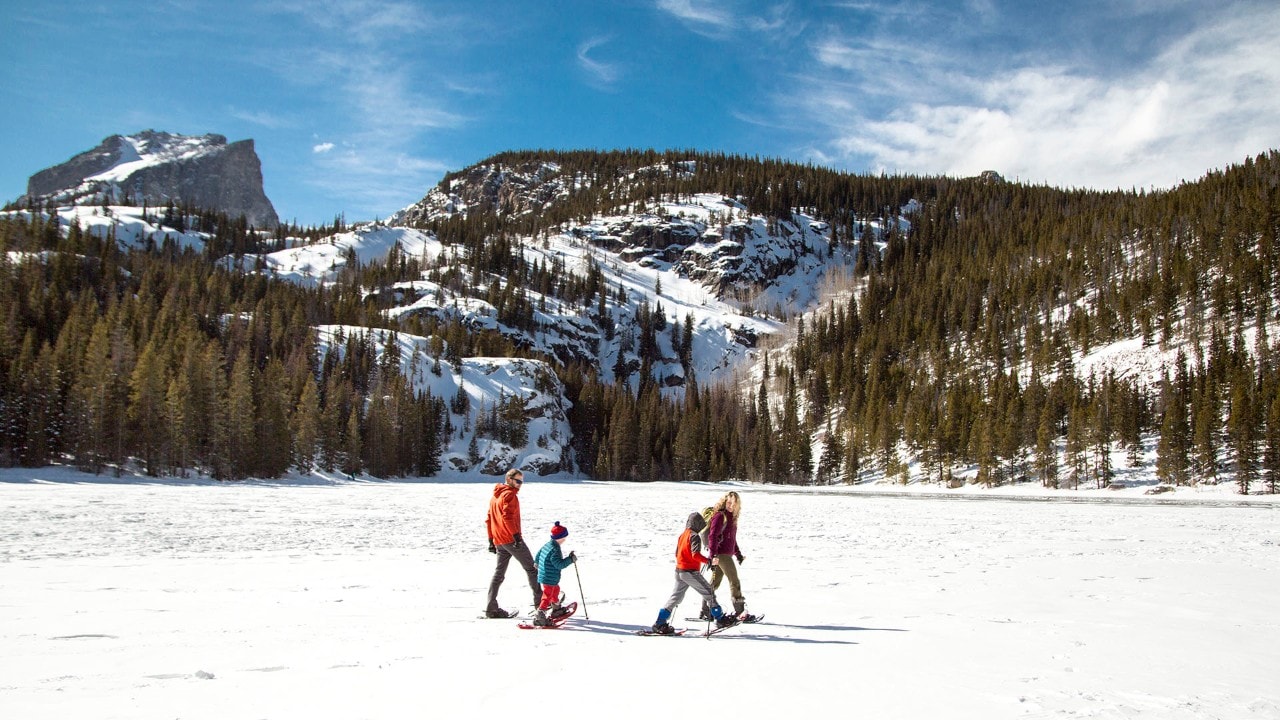 The family bonds while trying their new adventure in Rocky Mountain National Park.