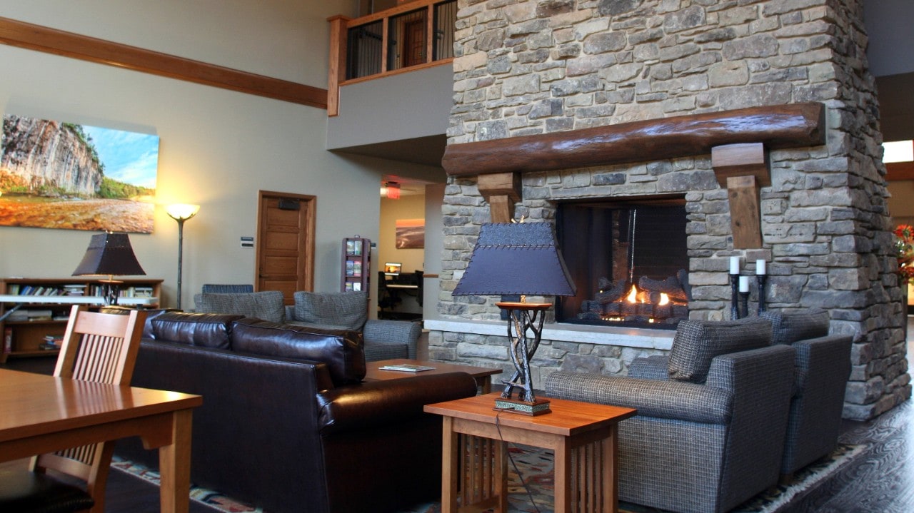 The lobby of the lodge is dominated by a soaring limestone fireplace.