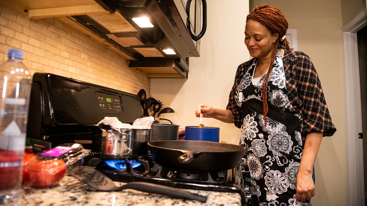 Maya stirs the Aji Amarillo sauce, a perfect accompaniment to roasted chicken or vegetables.