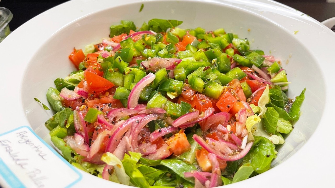 The Argentinian Ensalada Criolla includes chopped bell peppers, onion, tomato and garlic.