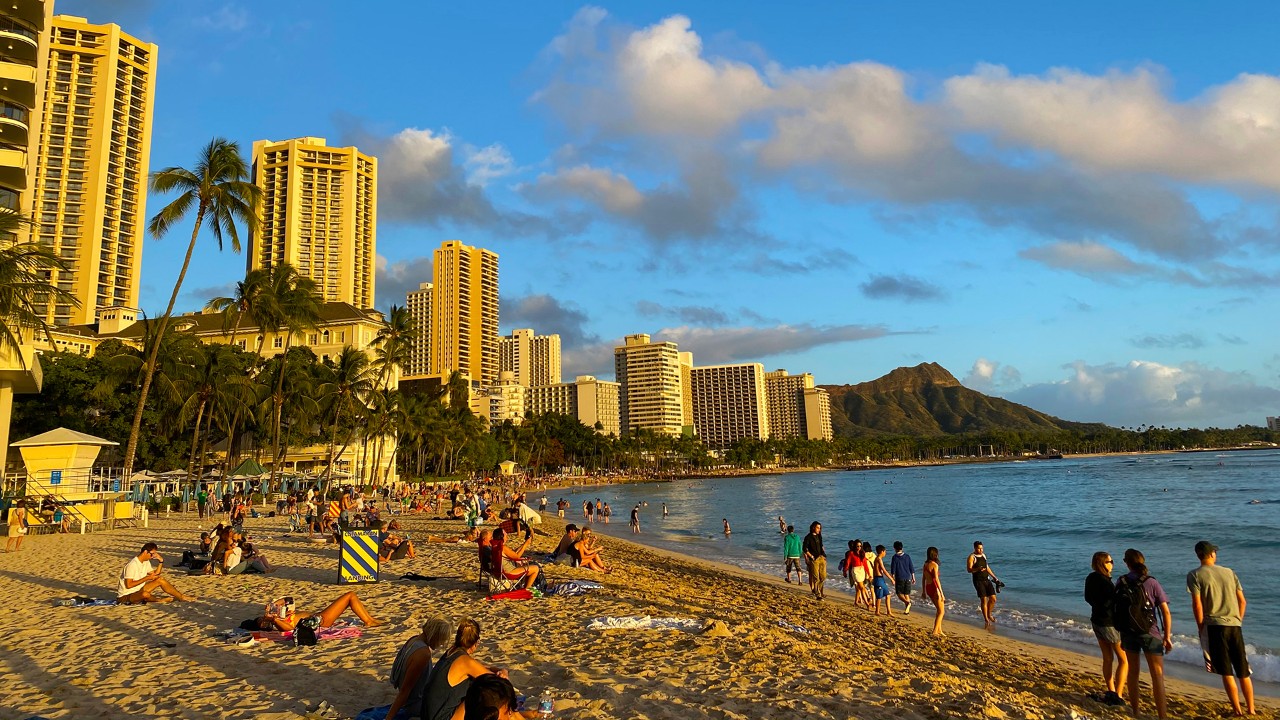 The sun sets on the world-famous Waikiki Beach in Honolulu.