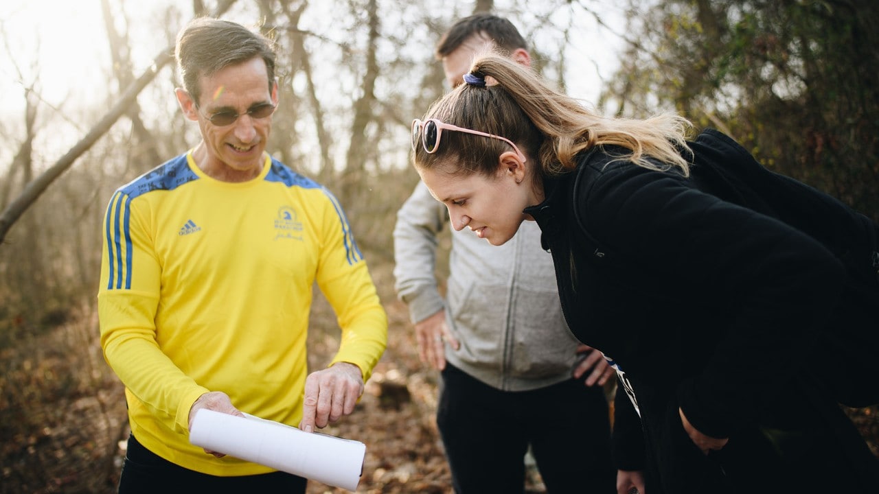 Race Director Bill Fleming shares course details with Abby before the race.