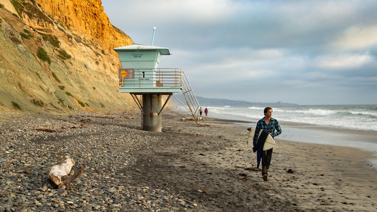 Jarrett Goldsmith surveys the waves on Torrey Pines State Beach.