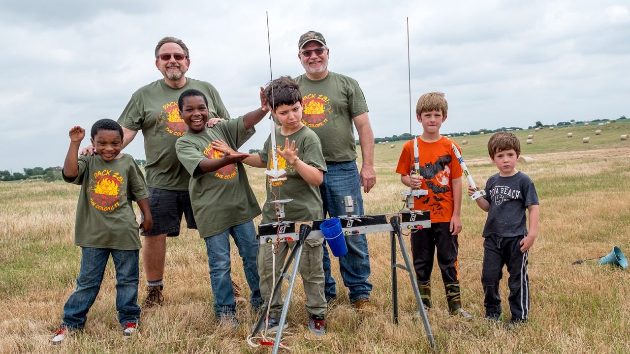 Cub Scouts from a nearby town pose with friends at the launch pad. 